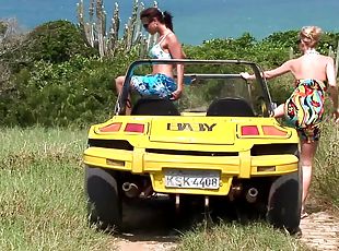 Tarra White and Aneta Keys take a leisurely stroll along the beach.