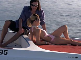 Smoking hot blondie is taking two huge cocks on the boat