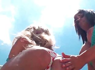 Outdoor hot lesbo scene with two girls in swim suits