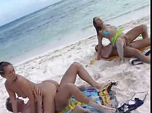 Two couples have sandy sex on the beach