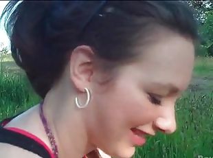 Blowjob in a grassy field from cute GF