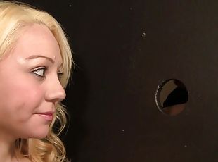 Fine blonde offers a nice view when she plays with cock through the glory hole