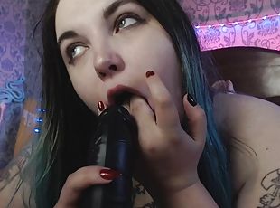 Sucking black dildo