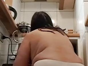 Mom cleaning the kitchen on all fours