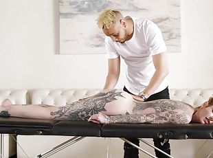 Lavishly tattooed slut Penny Archer gets fucked hard on the massage table