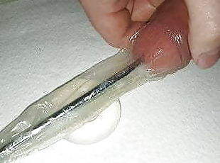 Urethral Sounding inside a condom, with cockring