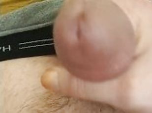 Stroking hard cock in bathroom