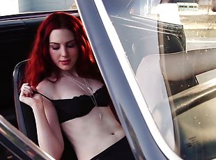 Redhead Alyssa Michelle poses in lingerie in a car