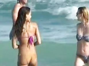 Jessica Alba wearing a purple bikini gets caught on voyeur's cam on a beach