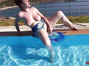 Mature redhead fucking and masturbating poolside