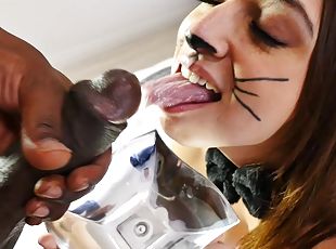 This naughty little kitty licks milk then enjoys some black cock