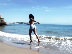 Slim Spanish Latina fucks herself on the beach