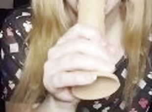 Hot Milf sucking white dildo.