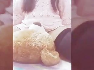 Girl playing with her teddy bear 7u7