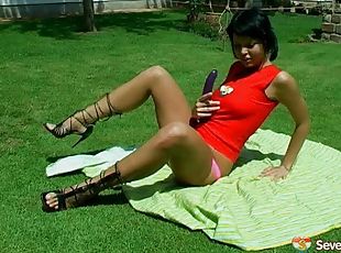 Dark haired teen in high heels enjoys masturbating nicely in this outdoors scene