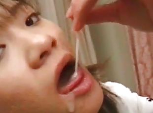 Brunette Asian doing blowjob to her man