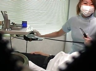 Japanese dentist enjoys stroking a dick of her very lucky patient