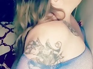 BBW in blue fishnets sucking on a dildo