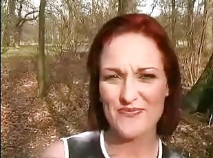 Salacious redhead falls to her knees and sucks dick outdoors