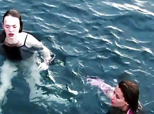 Two sexy babes get taped diving in the ocean while being naked