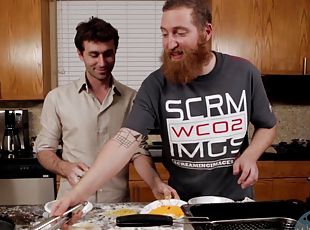 Handsome dude enjoys while making dinner in the backstage