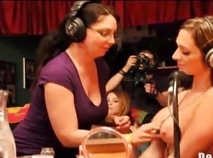 Ladies suck on tits on a radio show